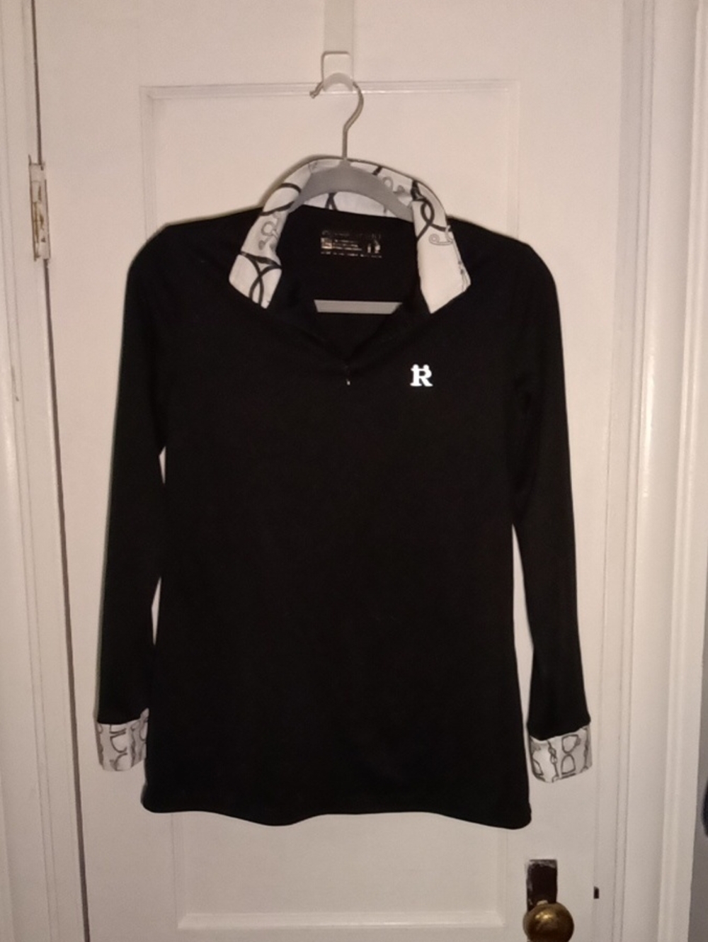 Woman Black Long-Sleeve Polo Top with White Patterned Trim
